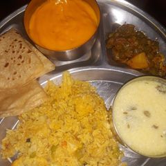 A picture of Aamras and double layered Rotli.