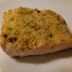 A picture of Salmon with a pistachio and red pepper crust.