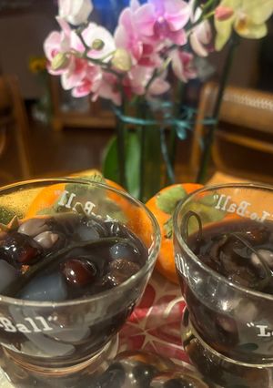 A picture of Red Date and Dried Persimmon Sweet Soup with Butterfly Pea Flower Water.