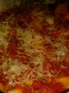 Una foto de Canelones de espinaca, ricota y choclo con salsa de tomate