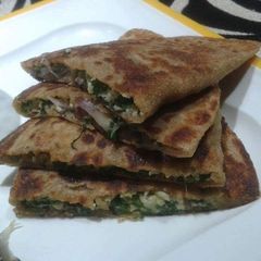 A picture of Palak paneer stuffed paratha.