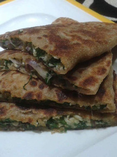 A picture of Palak paneer stuffed paratha.