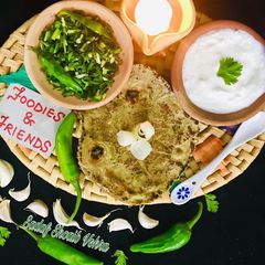 A picture of Lehsan with bajra roti (bajra no rotlo ne haro lahsan).