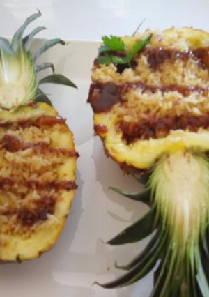 A picture of Fried Pineapple Rice on a Pineapple Boat.