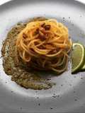 Spaghettini with grey mullet bottarga, lime and walnuts on truffle pesto