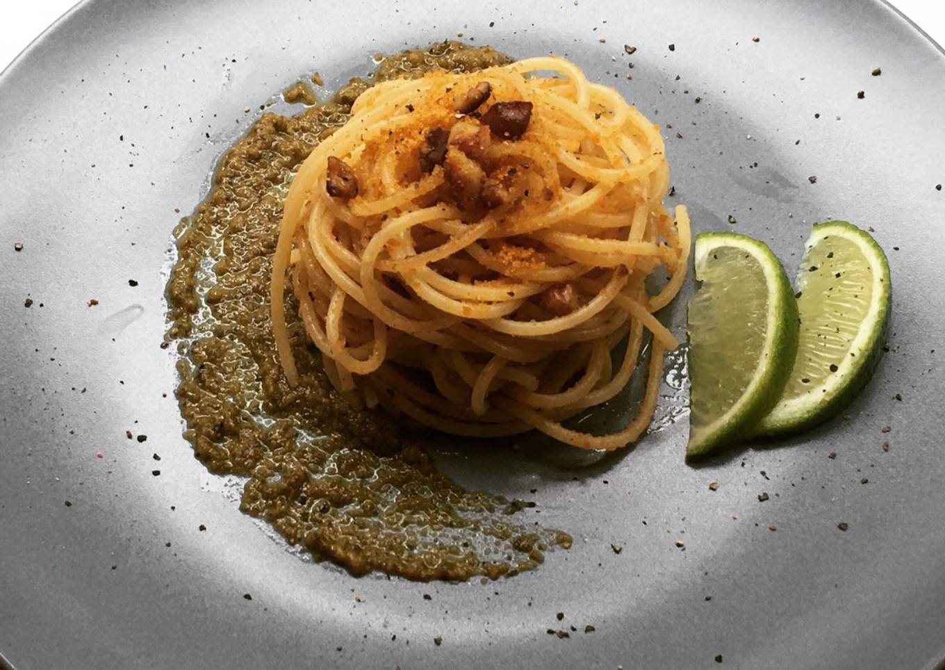 Spaghettini with grey mullet bottarga, lime and walnuts on truffle pesto