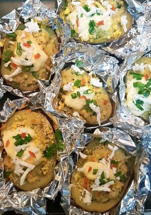 Una foto de Patatas rellenas bañadas con crema agria