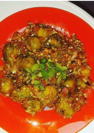 A picture of Brussels Sprouts in Veggie Sauce and Egg, with Basil.