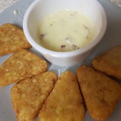 A picture of Hashbrowns and two Cheese and onion dip.