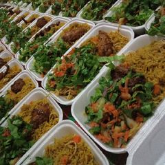 A picture of Party jollof rice with hot n spiced chicken and season salad.
