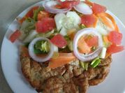 Una foto de aros de cebolla rellenos