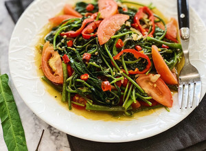 A picture of Tumis Kangkung Pedas (Spicy Water Spinach Stir Fry).