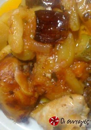 A picture of Chicken in wine with eggplants in the oven.