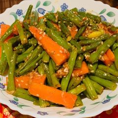A picture of Beans and carrots stir fry.