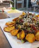 Tiritas de lomo al estilo oriental con chips de boniato