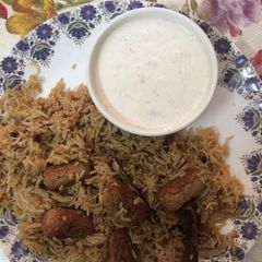 A picture of Cocktail chicken sausages in rice biryani.