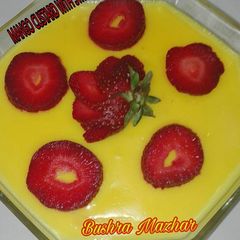 A picture of Mango Custard With Strawberry 🍓🍓.