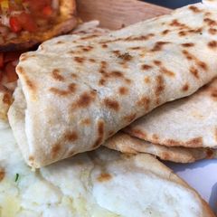 A picture of Manoushe (منقوشه) - Lebanese Flatbread with Toppings.