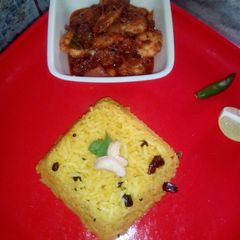 A picture of Lemon rice and prawn curry.