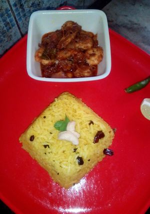 A picture of Lemon rice and prawn curry.