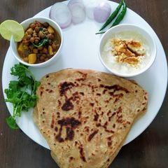 A picture of Plain Paratha with aloo chana ki sabji.