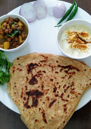 A picture of Plain Paratha with aloo chana ki sabji.