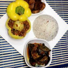 A picture of Ofada rice with snail sauce.