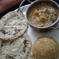A picture of Matar paneer with chatpata rice and chapati.
