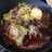 Huevos rotos con patatas, pimientos y jamón