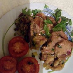 A picture of Roast beef (in a toaster)with grilled tomato.
