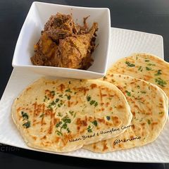A picture of Naan Bread & Hunglay Curry.