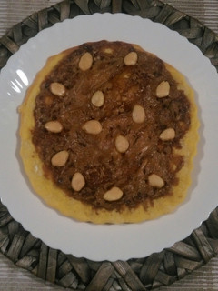 Una foto de Pizza de chocolates y almendras
