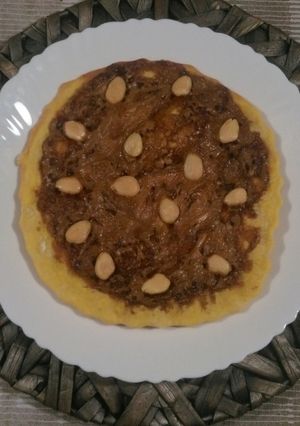 Una foto de Pizza de chocolates y almendras