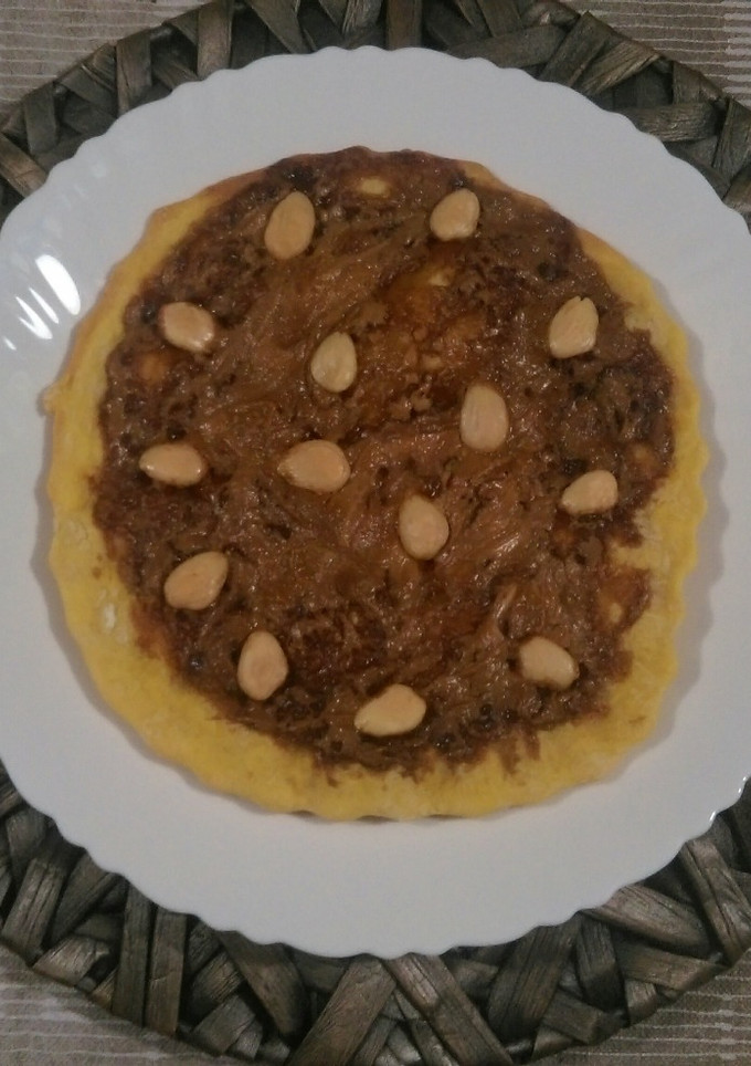 Una foto de Pizza de chocolates y almendras
