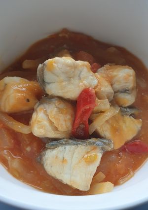 A picture of Barramundi in tomatoes sauce.