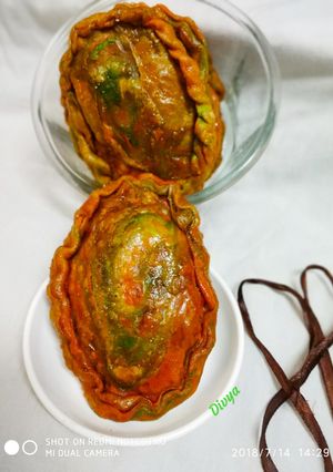 A picture of Tri colour drifruit stuffed kajjikaya.