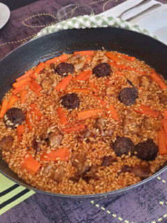 Una foto de Arroz de calabaza y morcilla granaína