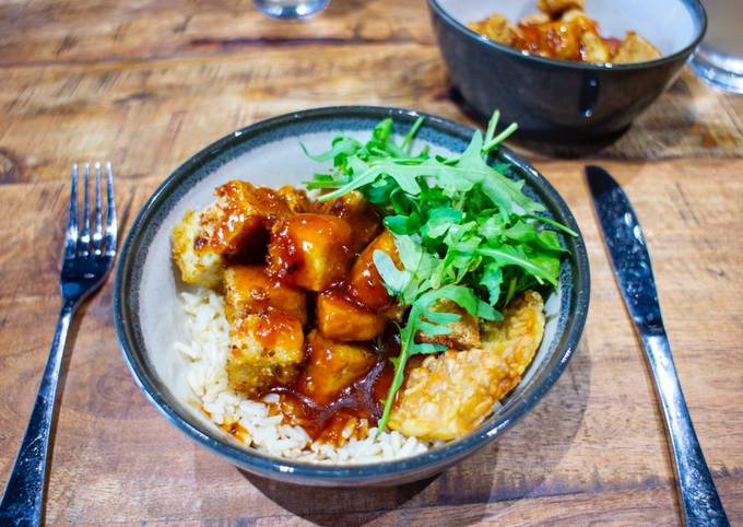 Crispy tofu top with sweet sticky and sour sauce with brown rice