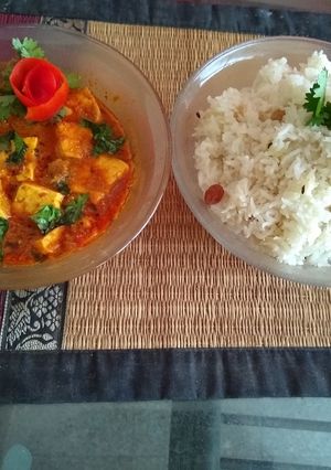 A picture of Paneer korma with jeera rice.