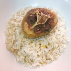 A picture of Coconut rice and boiled cowtail.