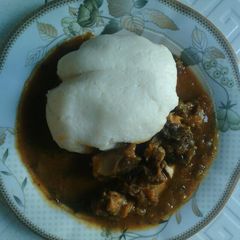 Tuwan shinkafa with taushe sauce A picture of Tuwan shinkafa with taushe sauce.
