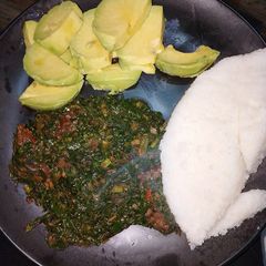 Ugali, sukuma mixed with beef and avocado A picture of Ugali, sukuma mixed with beef and avocado.