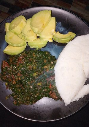 A picture of Ugali, sukuma mixed with beef and avocado.
