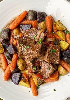A picture of Braised Wagyu Roast with Carrots and Potatoes.