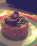 Jollof rice garnished with Beef and spring onions