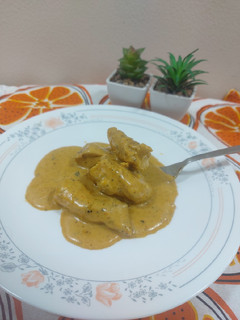 A picture of Chicken with ranch dressing sauce.