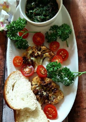 A picture of Grilled Cauliflower Steaks with Chimichuri Sauce.