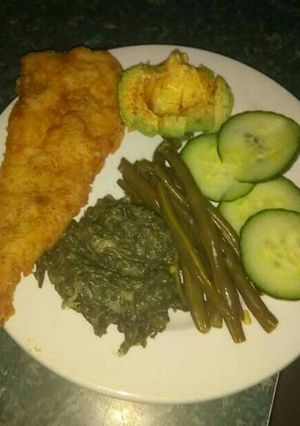 A picture of Fried fish and veggies.