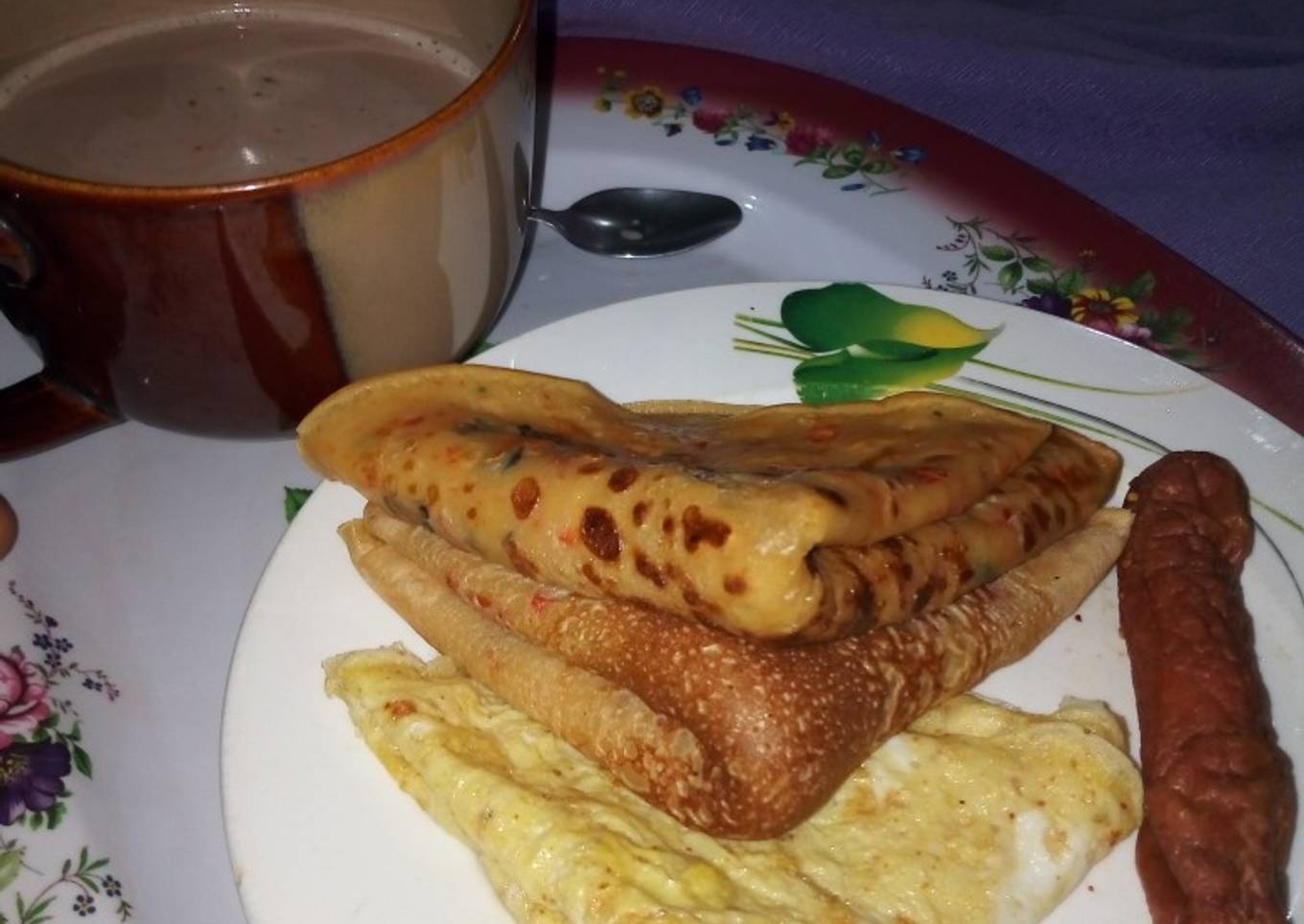 Pancakes, Fried Egg, Sausage with a cup of tea