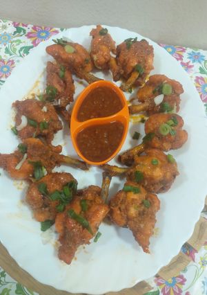A picture of Lollipops with schezwan sauce.